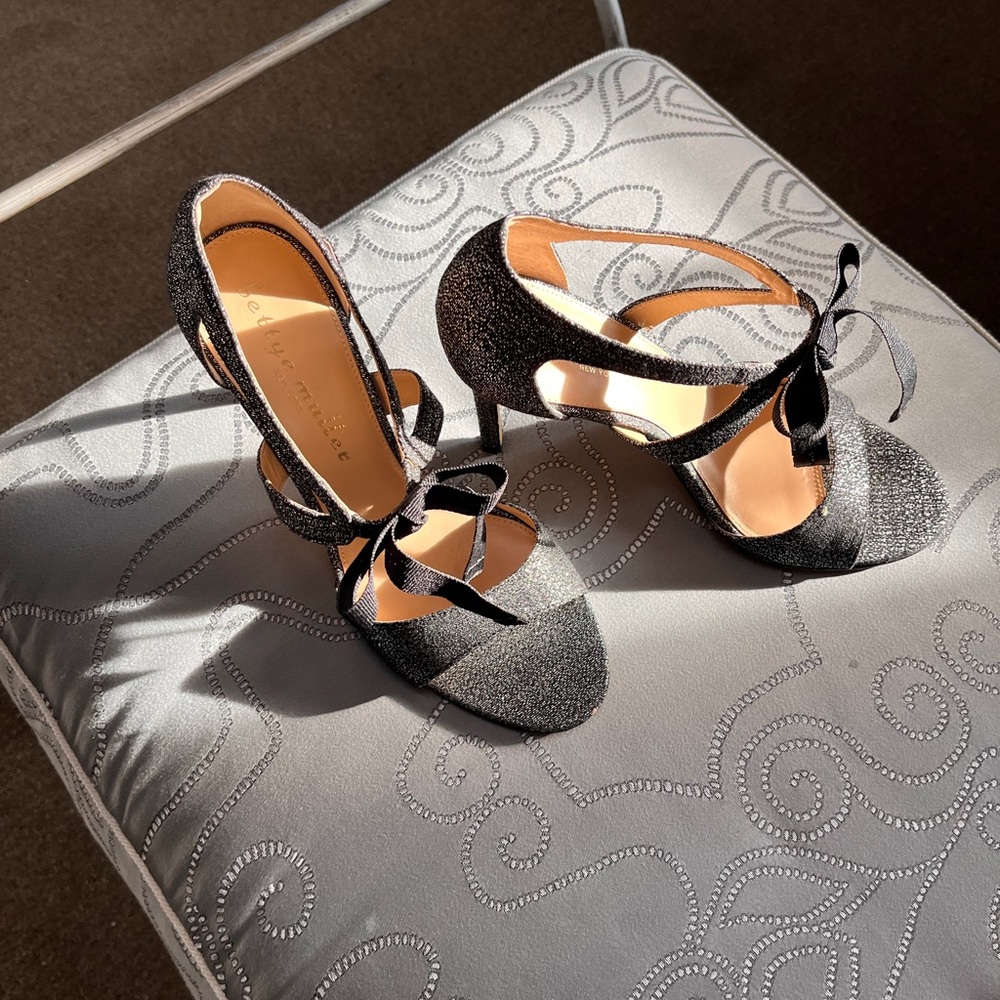 Holiday gorgeous  4” Silver dress heels with black grosgrain bow. Worn once.